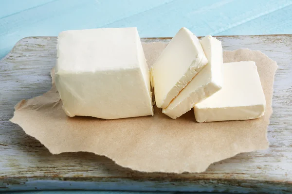 Fresh butter on cutting board — Stock Photo, Image