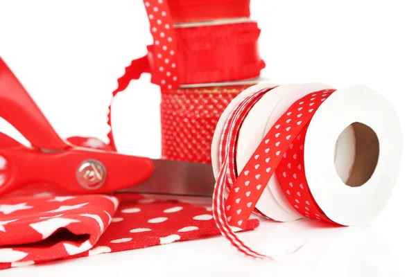 Ribbons with scissors and fabrics — Stock Photo, Image