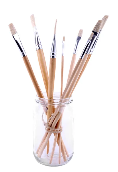Paint brushes in glass jar — Stock Photo, Image