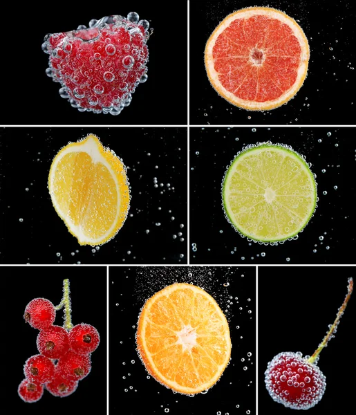 Collage de frutas y bayas en agua con burbujas sobre fondo negro — Foto de Stock