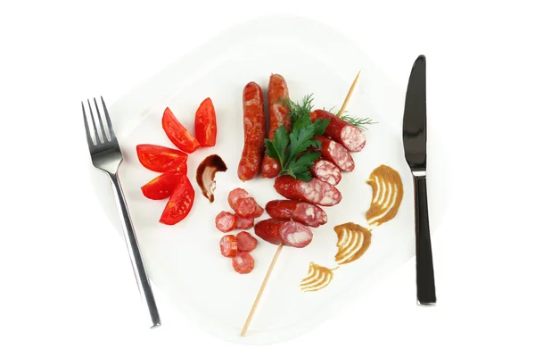 Assortment of tasty thin sausages on plate isolated on white — Stock Photo, Image