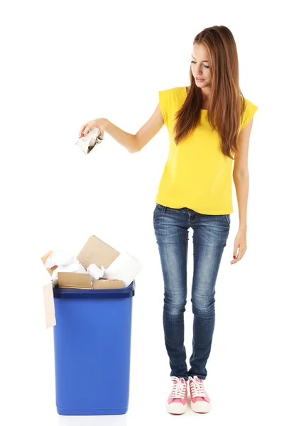 Young girl sorting paper and cardboard isolated on white — Stock Photo, Image