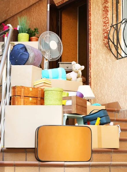 Moving boxes on stairs of new house, outdoors — Stock Photo, Image