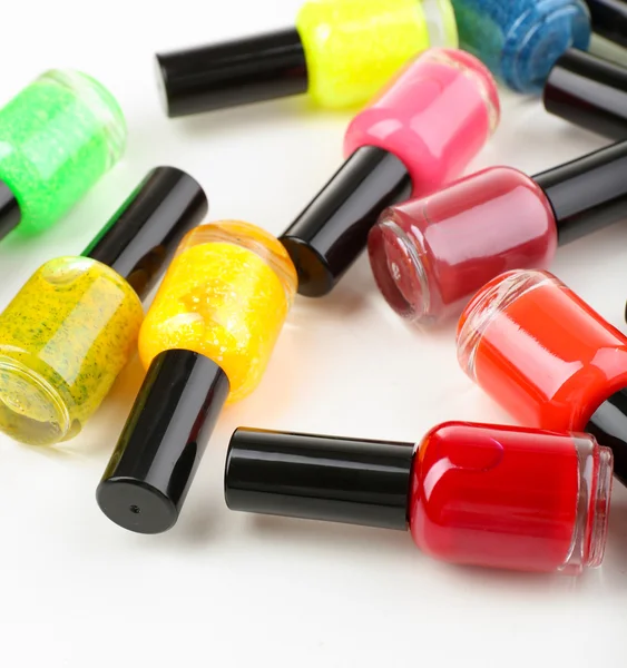 Colorful nail polishes, isolated on white — Stock Photo, Image
