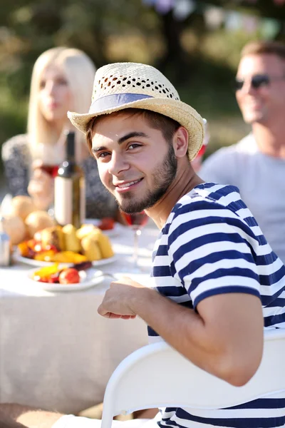 Young man with friends on rest — Stock Photo, Image
