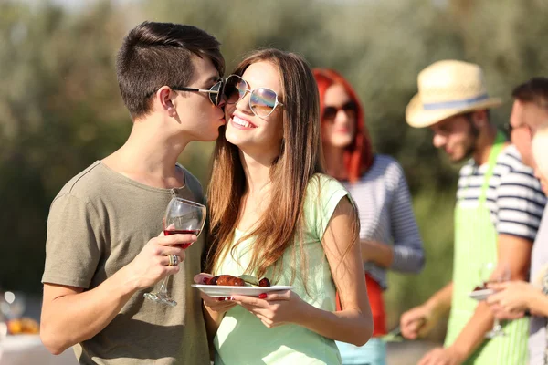 Young couple with friends on rest — Stock Photo, Image