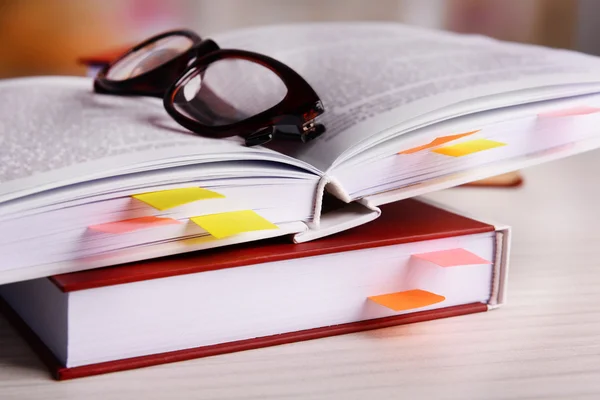 Book with bookmarks on table — Stock Photo, Image