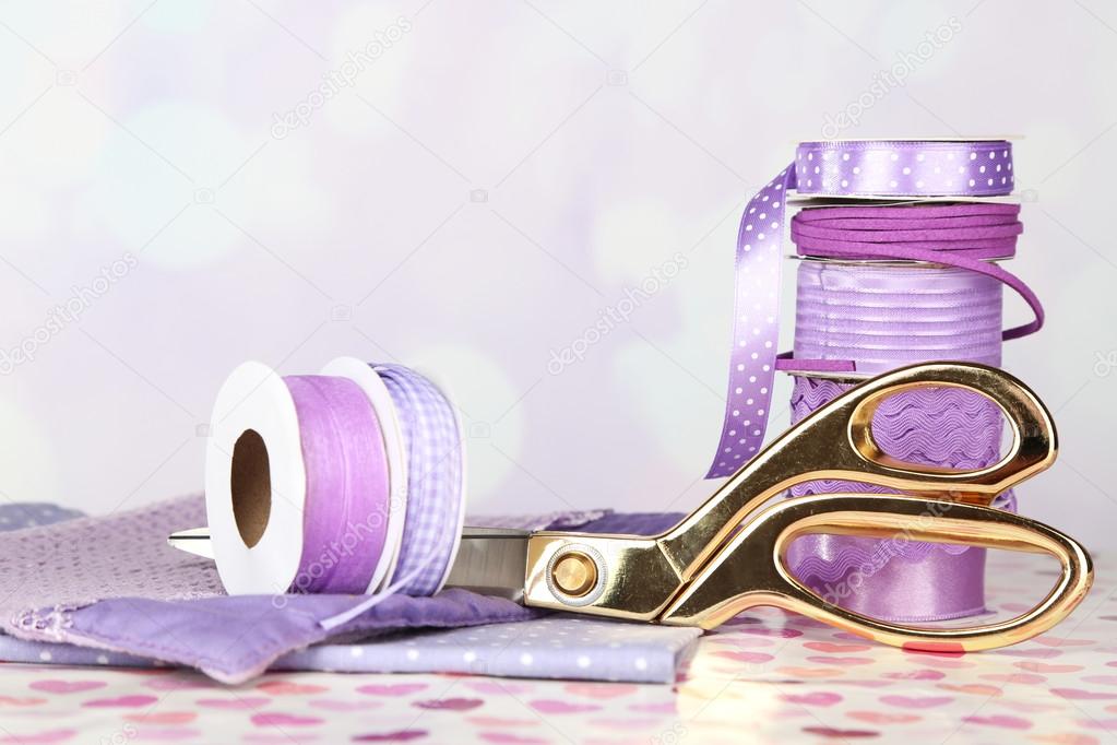 Ribbons with scissors and fabrics