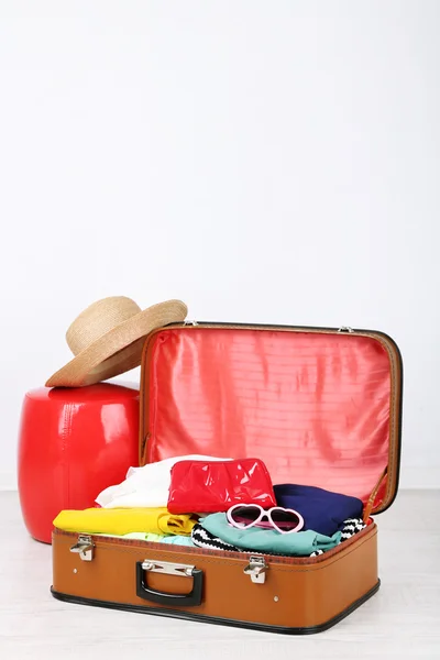 Female clothes in old suitcase — Stock Photo, Image