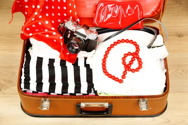 Female clothes in old suitcase — Stock Photo, Image