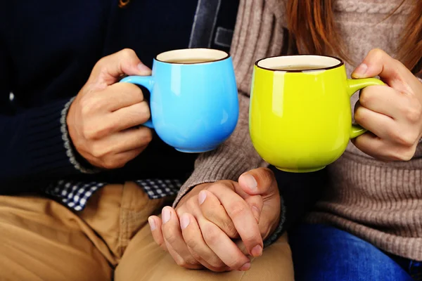 Young couple drinking tea, close-up — Stock Photo, Image