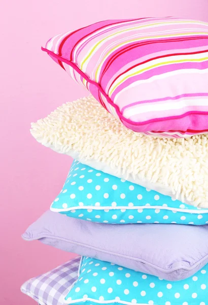 Bright pillows on pink background — Stock Photo, Image