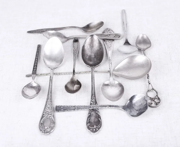 Metal spoons on fabric — Stock Photo, Image