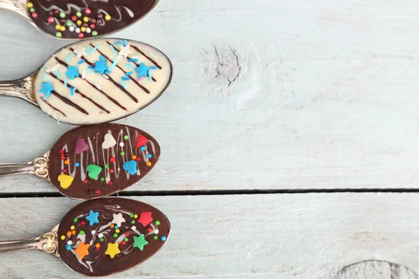 Spoons with tasty chocolate — Stock Photo, Image