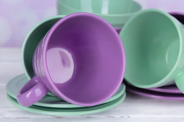 Bright dishes and cups on table