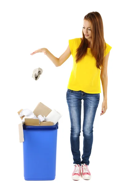 Young girl sorting paper and cardboard isolated on white — Stock Photo, Image