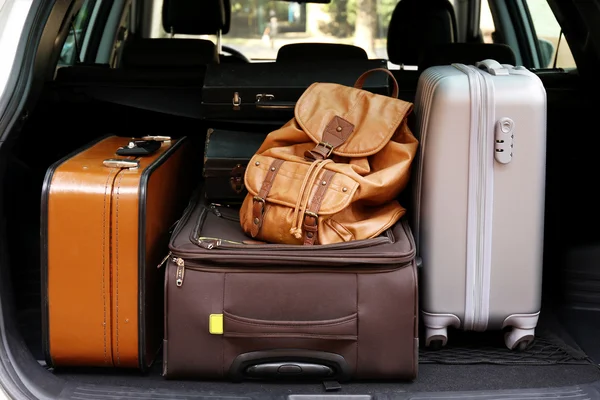 Suitcases and bags in trunk of car — Stock Photo, Image