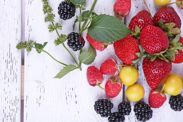 Different berries on wooden table close-up — Stock Photo, Image