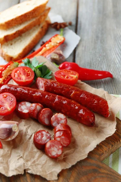 Smoked thin sausages and vegetables — Stock Photo, Image