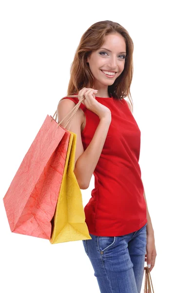 Jonge vrouw met boodschappentassen — Stockfoto