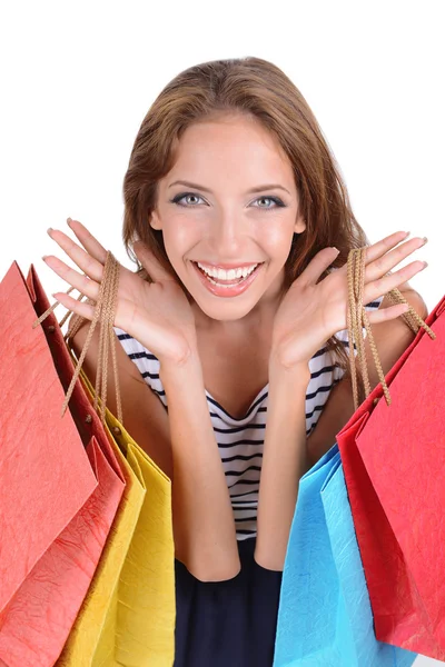 Beautiful young woman with shopping bags isolated on white Stock Photo