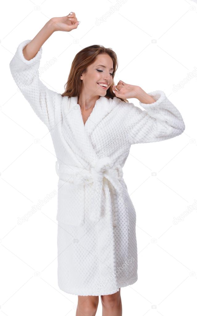 Beautiful young girl in bathrobe isolated on white