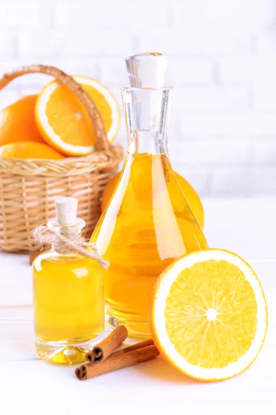 Tangerine oil on table — Stock Photo, Image