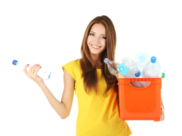 Young girl sorting plastic bottles isolated on white — Stock Photo, Image