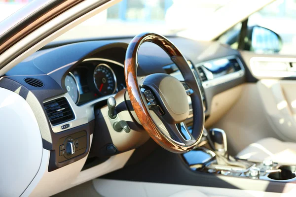 Interior view of car with beige salon and black dashboard — Stock Photo, Image