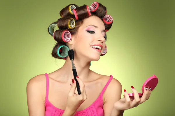 Beautiful girl in hair curlers — Stock Photo, Image