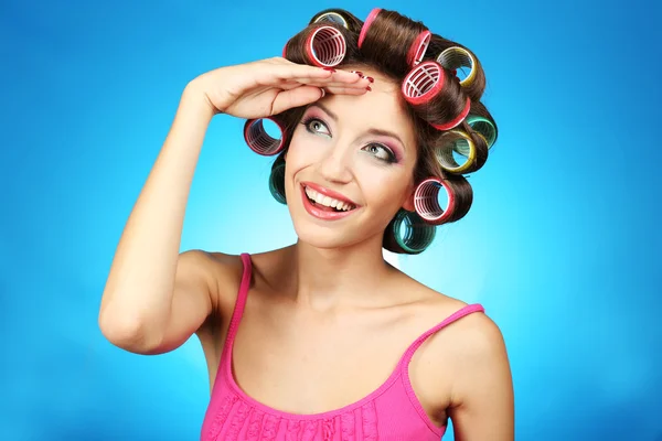 Beautiful girl in hair curlers — Stock Photo, Image