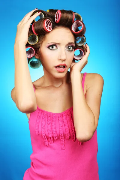 Beautiful girl in hair curlers — Stock Photo, Image