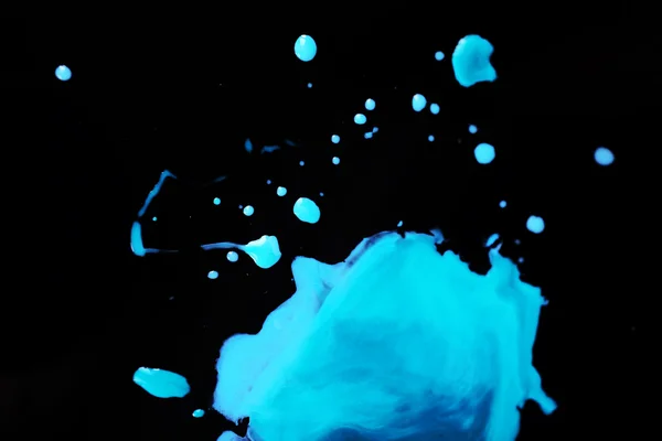 Spilled paint on black — Stock Photo, Image