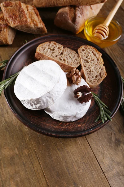 Camembert cheese on plate — Stock Photo, Image
