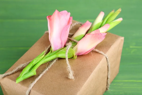 Gift box with fresh flowers — Stock Photo, Image