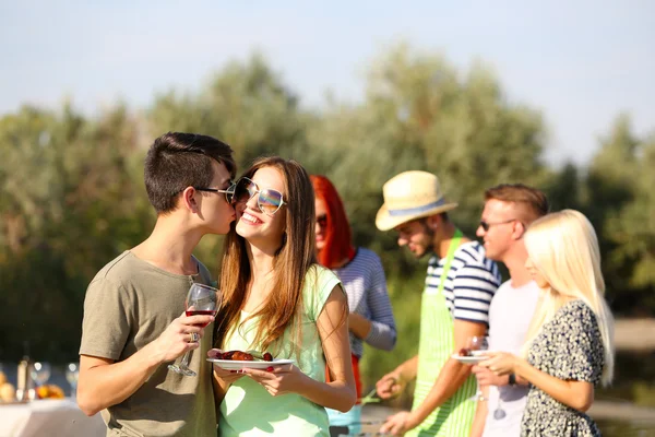 Young couple with friends on rest — Stock Photo, Image