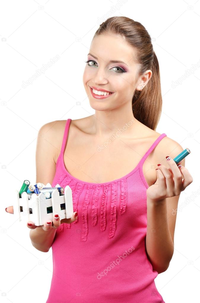 Young girl sorting battery isolated on white