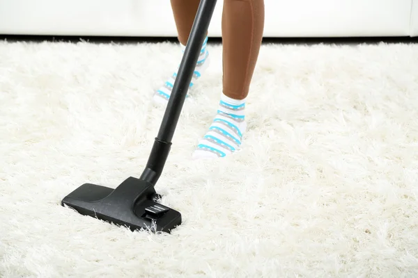 Girl vacuuming in room — Stock Photo, Image