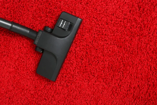 Vacuum cleaner to tidy up carpet — Stock Photo, Image
