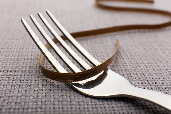 Tying bow on fork — Stock Photo, Image