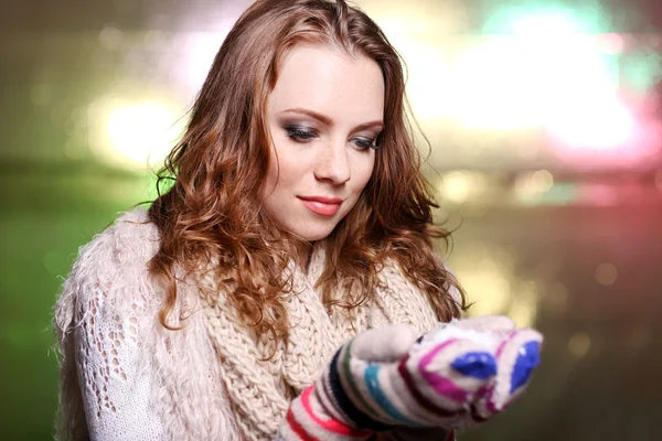 Portrait of woman in scarf and gloves on bright background — Stock Photo, Image