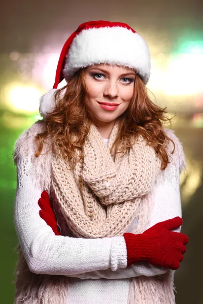 Portrait of woman in scarf and gloves on bright background — Stock Photo, Image