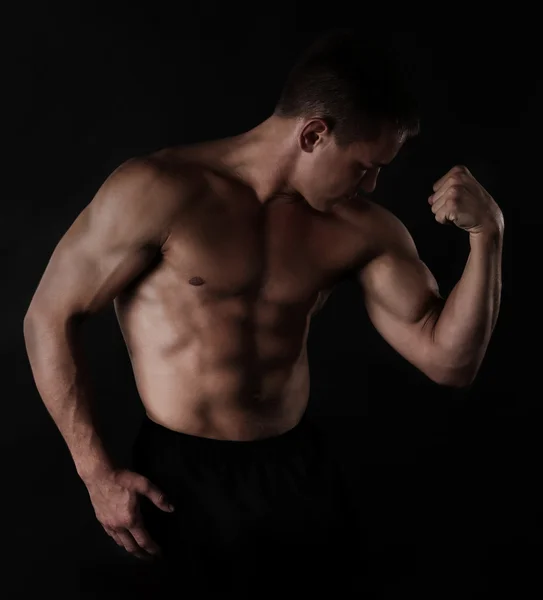 Sexy muscular man on dark background — Stock Photo, Image