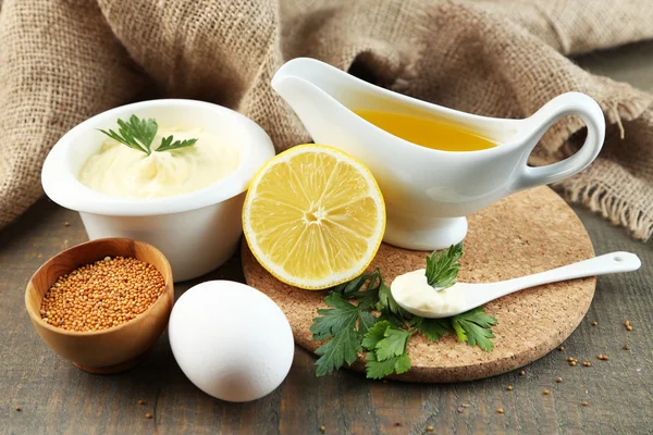 Mayonnaise ingredients on wooden background — Stock Photo, Image