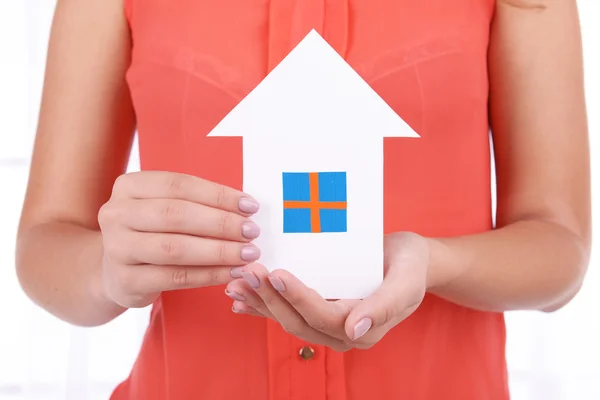 Woman hands with paper house — Stock Photo, Image