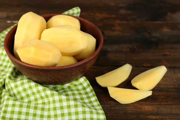 Raw peeled potatoes in bowl — Stock Photo, Image