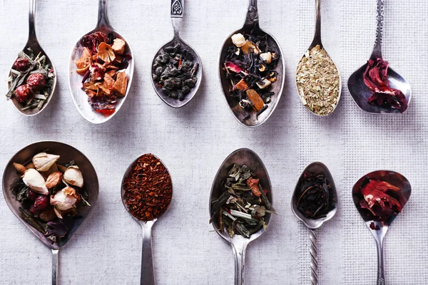 Tea in metal spoons — Stock Photo, Image