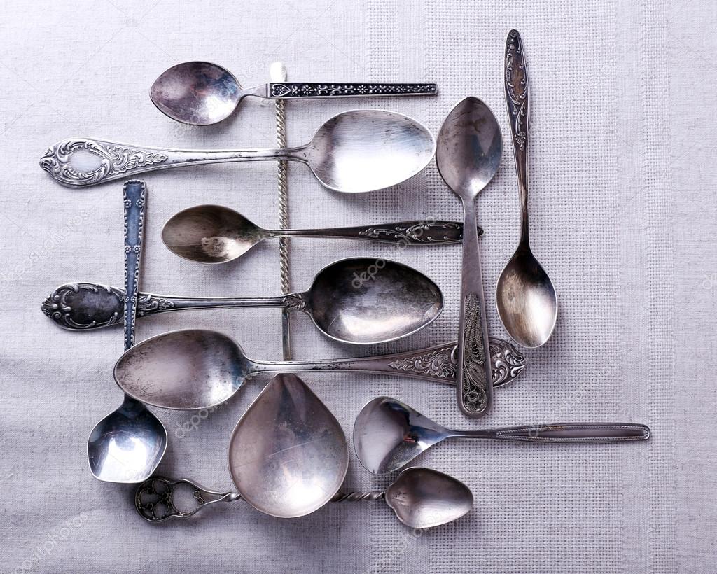 Metal spoons on fabric