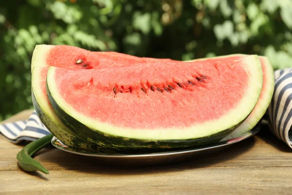Fresh slice of watermelon on table outdoors, close up — Stock Photo, Image