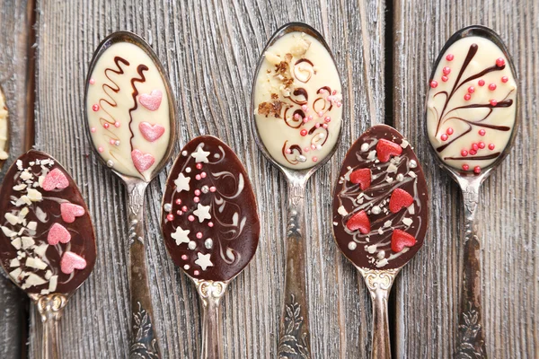 Spoons with tasty chocolate — Stock Photo, Image